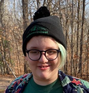 Black Pom Pom Knit Cap with Green Embroidered Logo